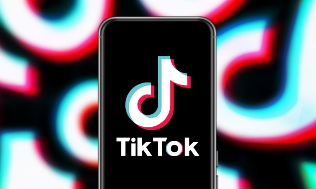 Image of TikTok logo on Black iPhone.